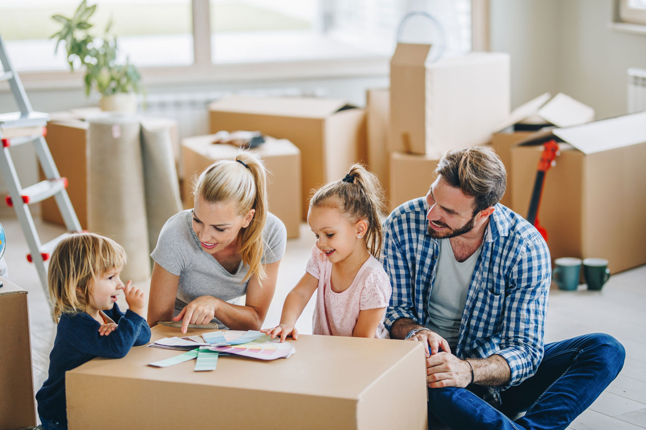 A happy family choosing paint colours